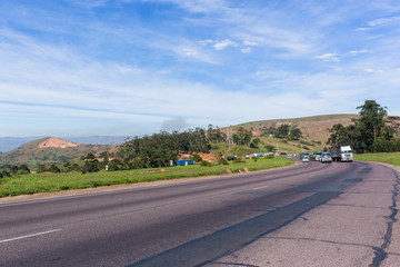 Trucks Vehicles Hill Climb Highway countryside landscape.