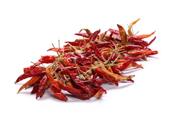Dry red hot chili peppers, pile isolated on white background