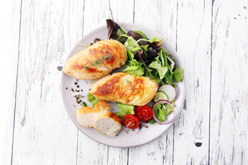 Grilled Chicken Breast with Salad and cherry tomatoes.