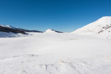 Fototapeta na wymiar Winter landscape with snow. Campo Felice, Italy
