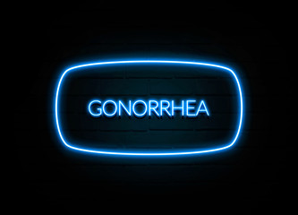 Gonorrhea  - colorful Neon Sign on brickwall