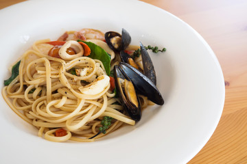 Seafood pasta in white plate. Italian food. Healthy and tasty. Hi nutrition.