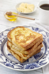 French toast served with honey and cheese.