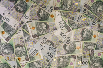 Polish currency banknotes as a background 100 zl