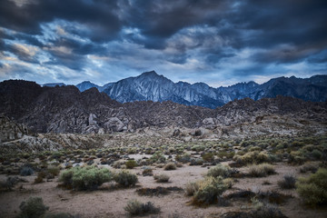 mountains and rock at alabama hills california with moody clouds