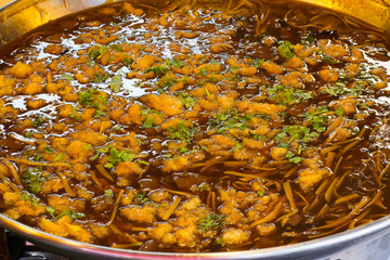 braised fish maw with red gravy sauce in big pan on market
