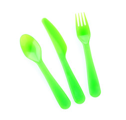 Colorful eating utensils for baby on white background