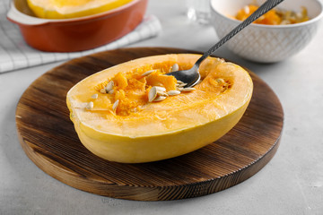 Cut spaghetti squash on wooden board