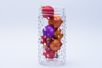 Unique jar of colorful ornaments for holiday