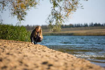 Girl walking along the beach