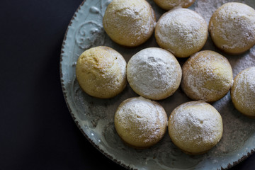 Tasty vanilla muffins on an ornamented plate