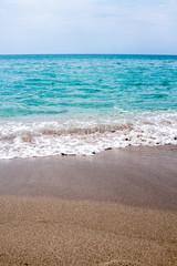 Fototapeta na wymiar Beautiful beach and aqua waves, clean sand, calm sea