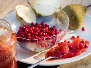 Pear and lingonberry jam on table, natural organic food - homemade preserve for winter 