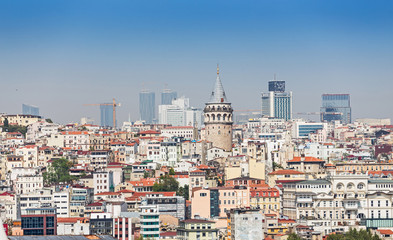 Naklejka premium Far away tele view of a Galata tower district with various buildings, classical cityscape of Istanbul, Turkey