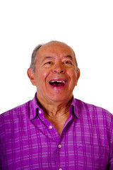 Portrait of a happy mature man laughting very loud and wearing a purple square t-shirt in a white background