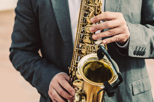 Man Playing Saxophone Outdoors