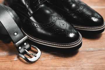 Fototapeta na wymiar Male black shoes with belt