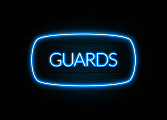 Guards  - colorful Neon Sign on brickwall