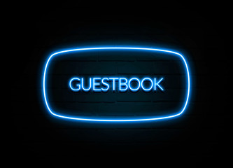 Guestbook  - colorful Neon Sign on brickwall