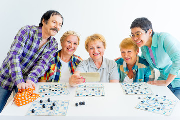 Senior people playing board games - 177318913