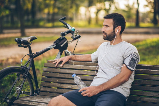 Cycler Taking a Break on the Bench