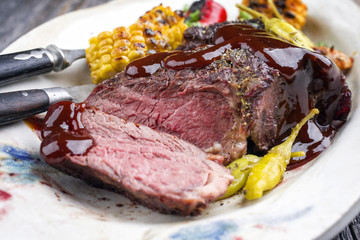 Barbecue wagyu chateaubriand with vegetable and maize as close-up on a plate