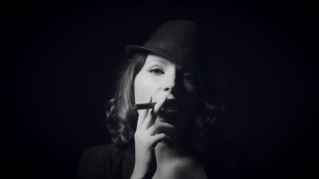 4k Gagster Style Woman Holding Cigar in Mouth, b & w