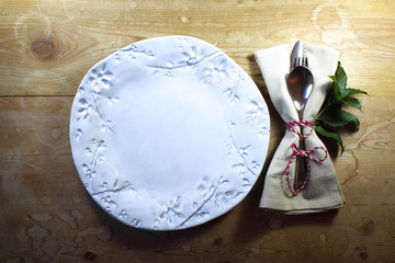 Rustic casual country dinner place setting with hand made plate for Thanksgiving or Christmas
