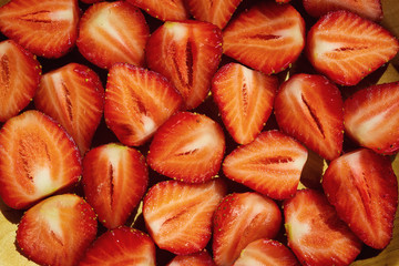 cut strawberries, strawberries in a cut,strawberries in basket, strawberries on wooden table, strawberry, basket with strawberries, strawberries in natural background,fruit concept,fresh strawberry