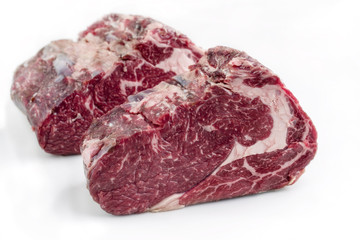 Obraz premium Two Raw dry aged Kobe rib eye Steak as close-up – covered