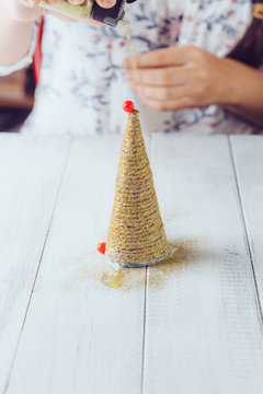 The twine Christmas tree sprinkled with glitter
