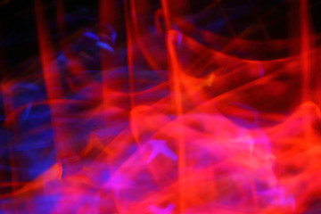 Blurred bright abstraction of a fiery background with colored lines. The constant fiery flame of natural gas, the bright texture brightly burns.