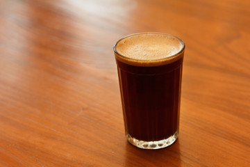 A glass of fragrant coffee grinding
