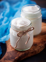 Natural greek yoghurt in glass jars. 