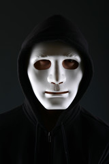 Man in a mask with a gun