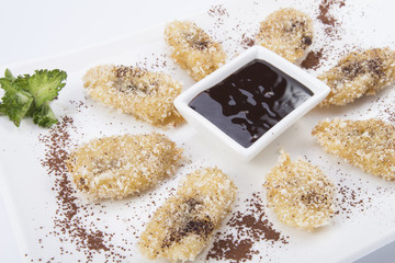 fried banana with cherry jam on white backgrounds