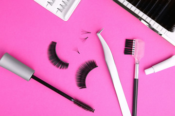 Set with false eyelashes on color background