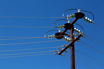 power line with electrical pole in the clear sky
