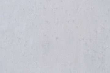 Texture of white fresh snow lying on the ground