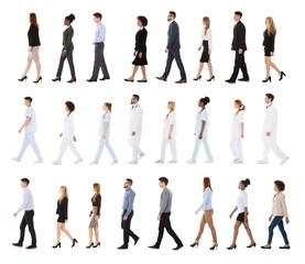 Multiracial Businesspeople Walking In Row