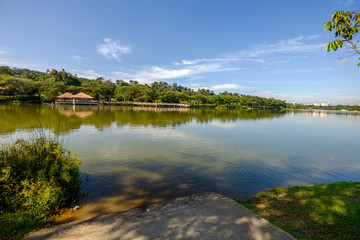 Obraz premium Beautiful view of lakeside water theme park with blue sky at Wetland , Putrajaya