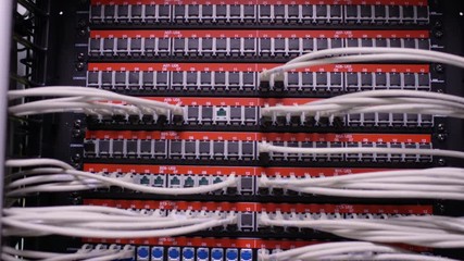 Group of computer technicians checking the servers in a data center. - Powered by Adobe