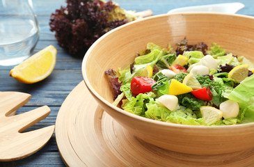 Delicious vegetable salad on table