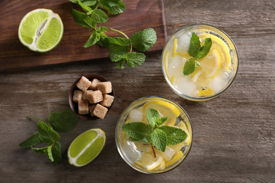 Composition with fresh mojito cocktail on wooden background