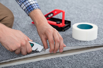 Carpenter Laying Carpet
