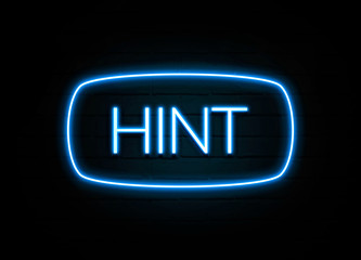 Hint  - colorful Neon Sign on brickwall