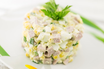 Salad from canned corn, sausage, eggs and onion