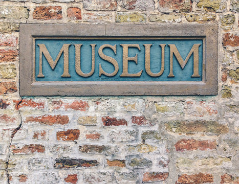 Museum Sign on the Brick Wall