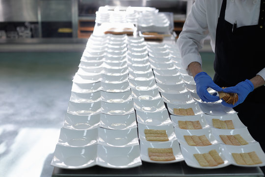 Restaurant chef preparing plates for a  feast