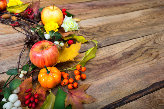 Thanksgiving wreath with pumpkin, apples, barberry, rowan, copy space